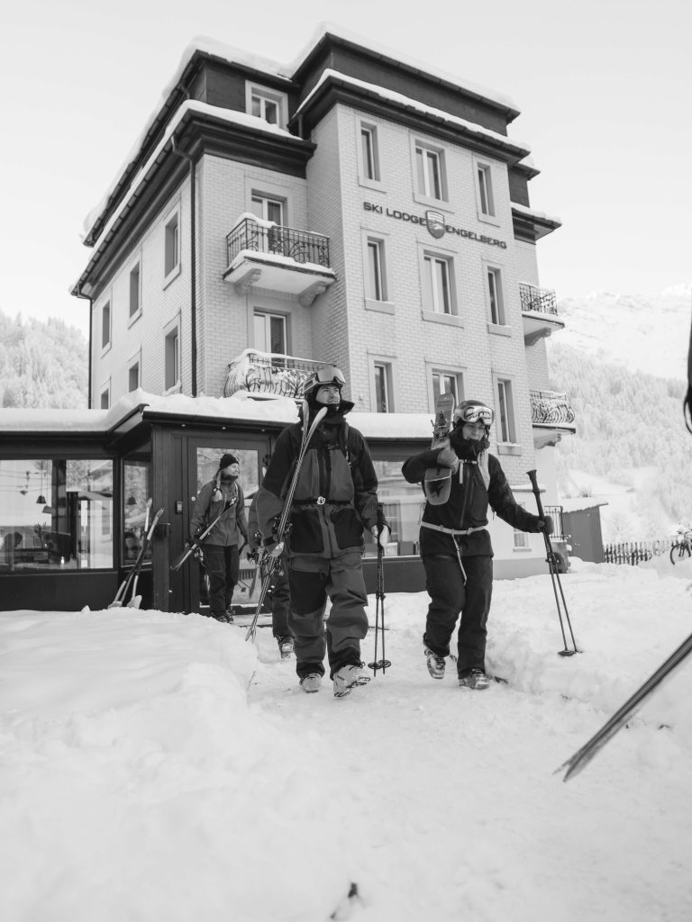 Skiers on their way to the best powder day in their life in Engelberg.